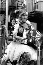 Baby Dee playing an accordian on her harpcycle - copyright Paul Coughlin